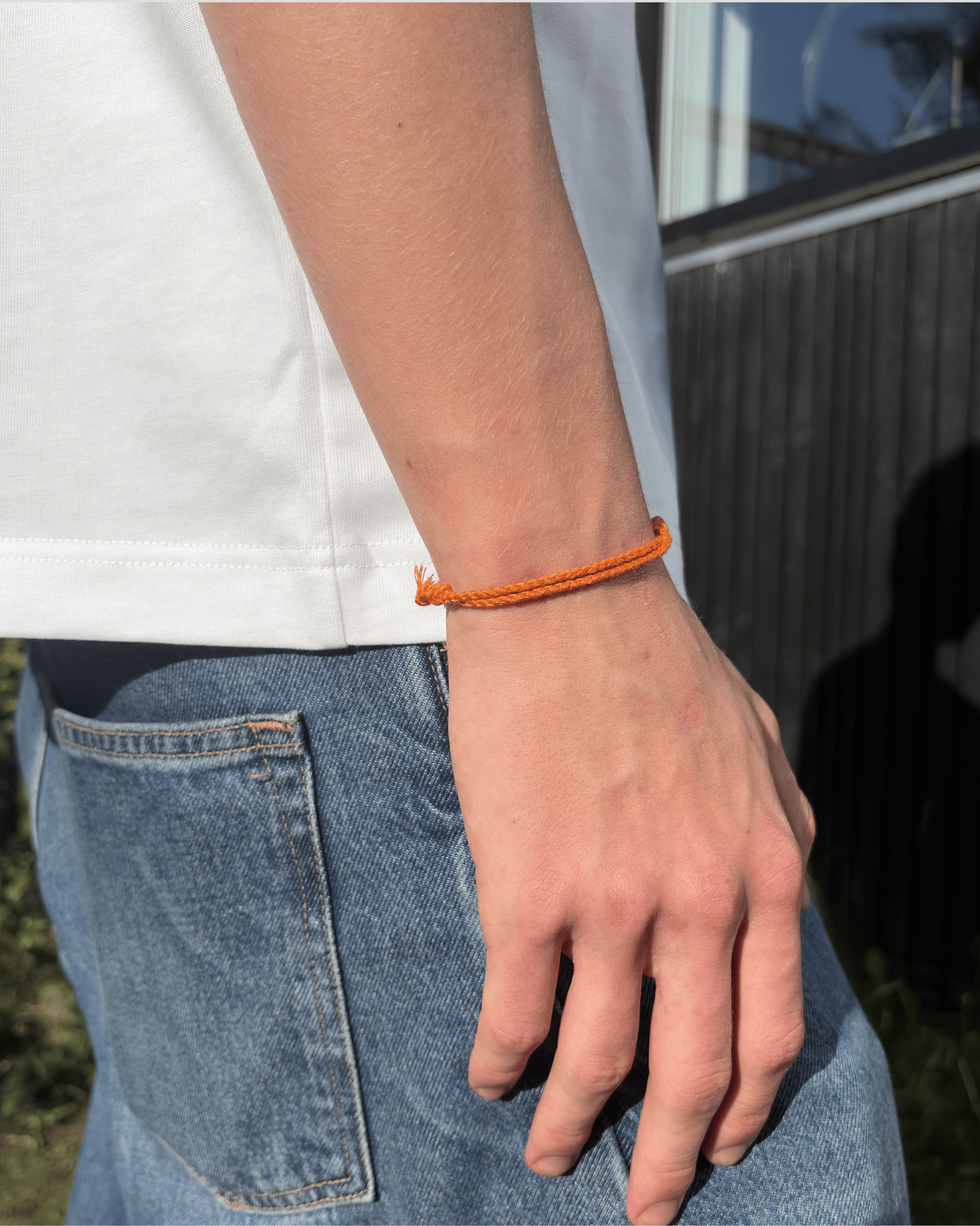 Justerbart Orange Armbånd